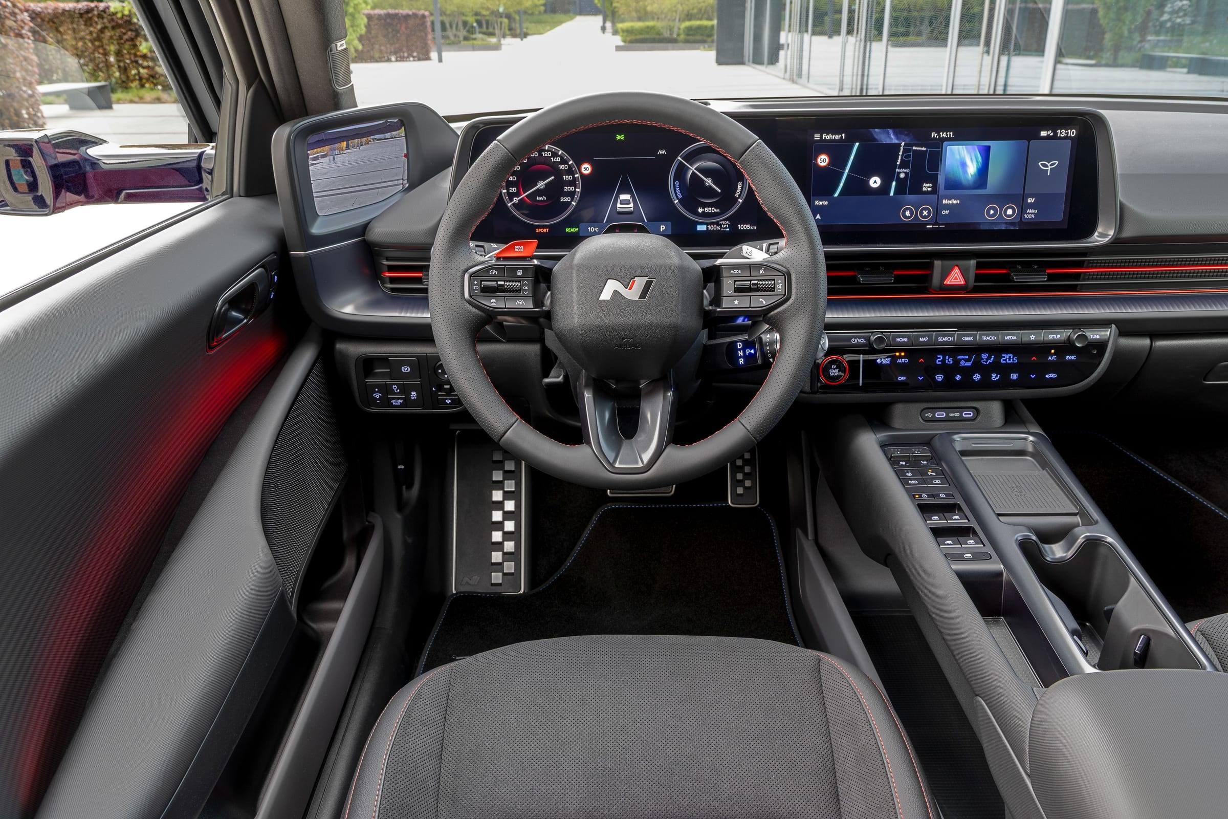 The dashboard of the Hyundai Ioniq 6 N Line, with two wide screens, an N steering wheel and a centre console