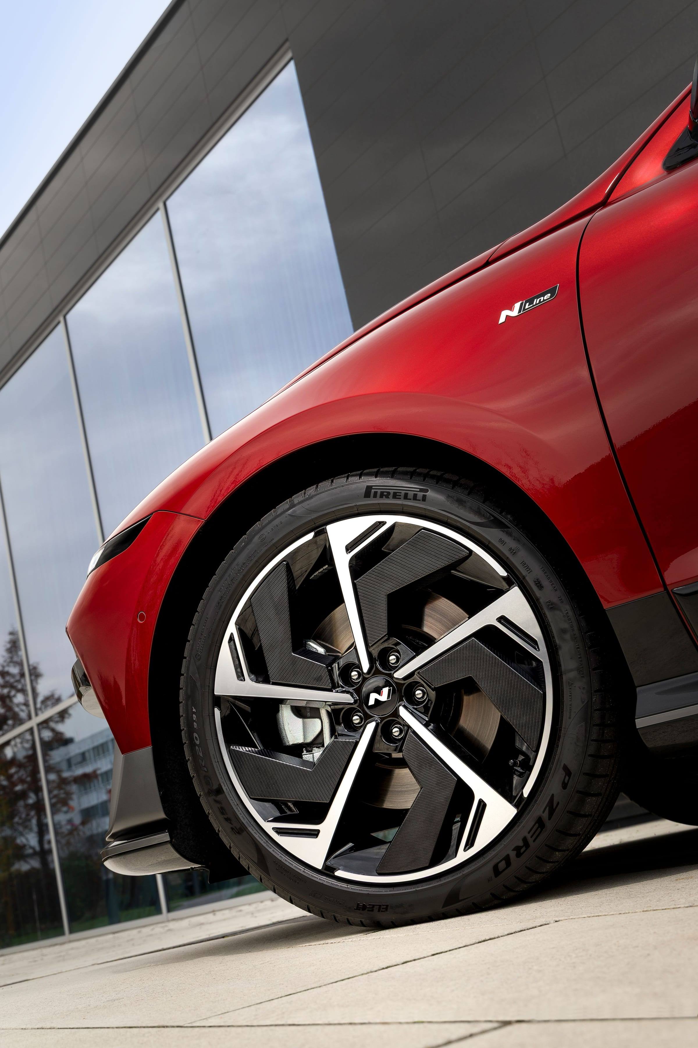 Close-up of a 20-inch two-tone alloy wheel on a red Hyundai Ioniq 6 N Line