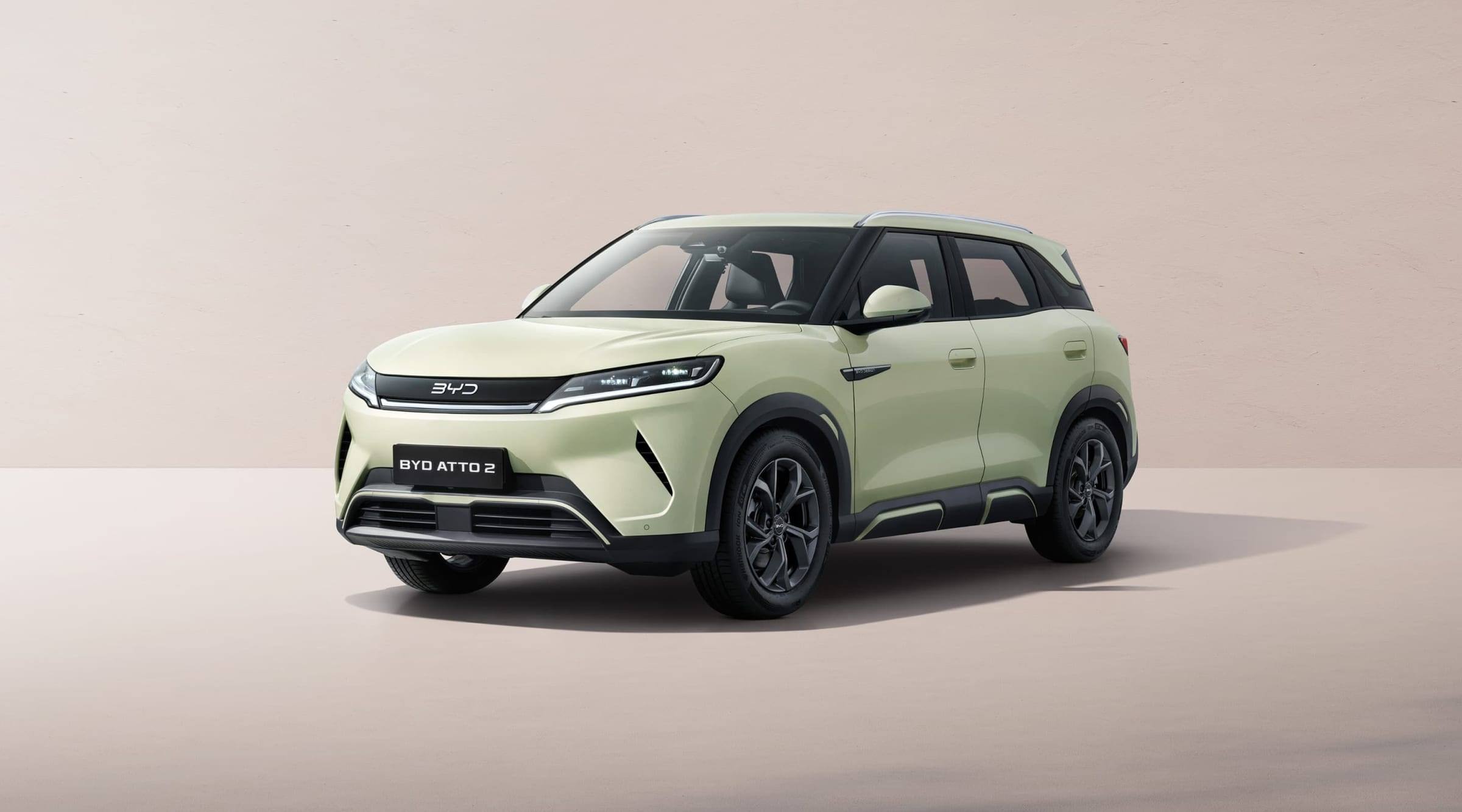 Pale green BYD Atto 2, front three-quarter view in a studio