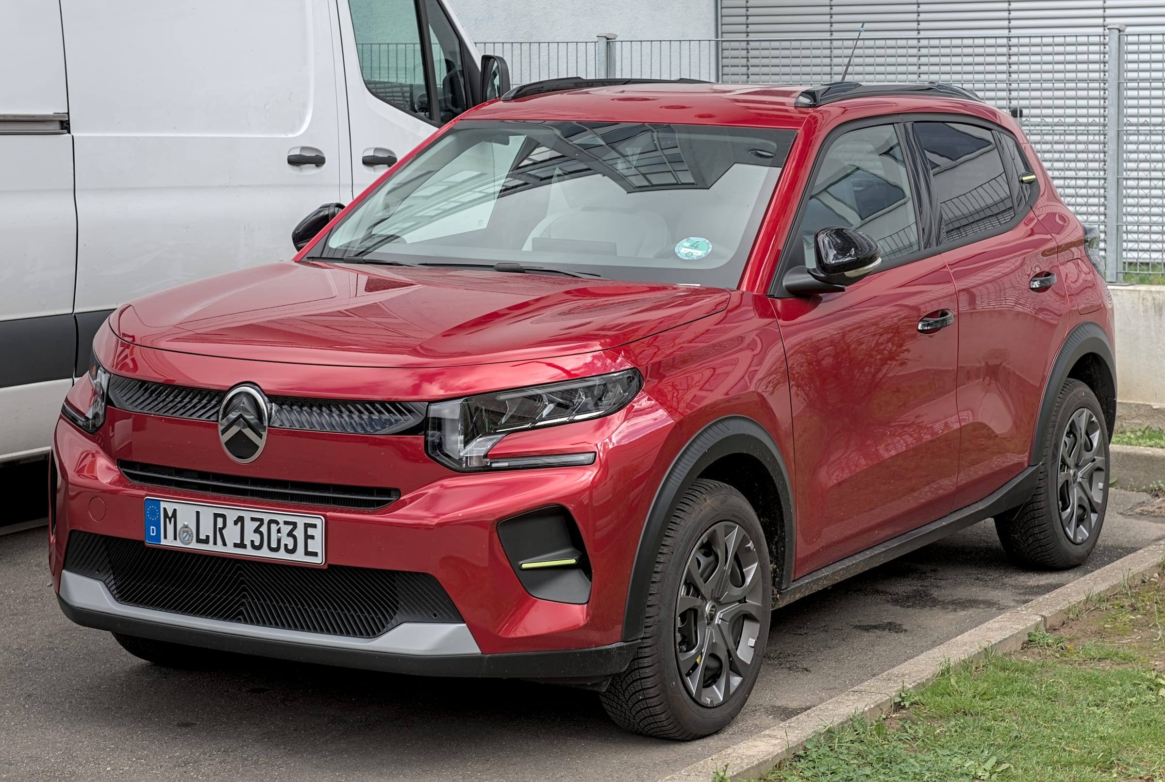 Red Citroën ë-C3, front three-quarter view, parked in Stuttgart