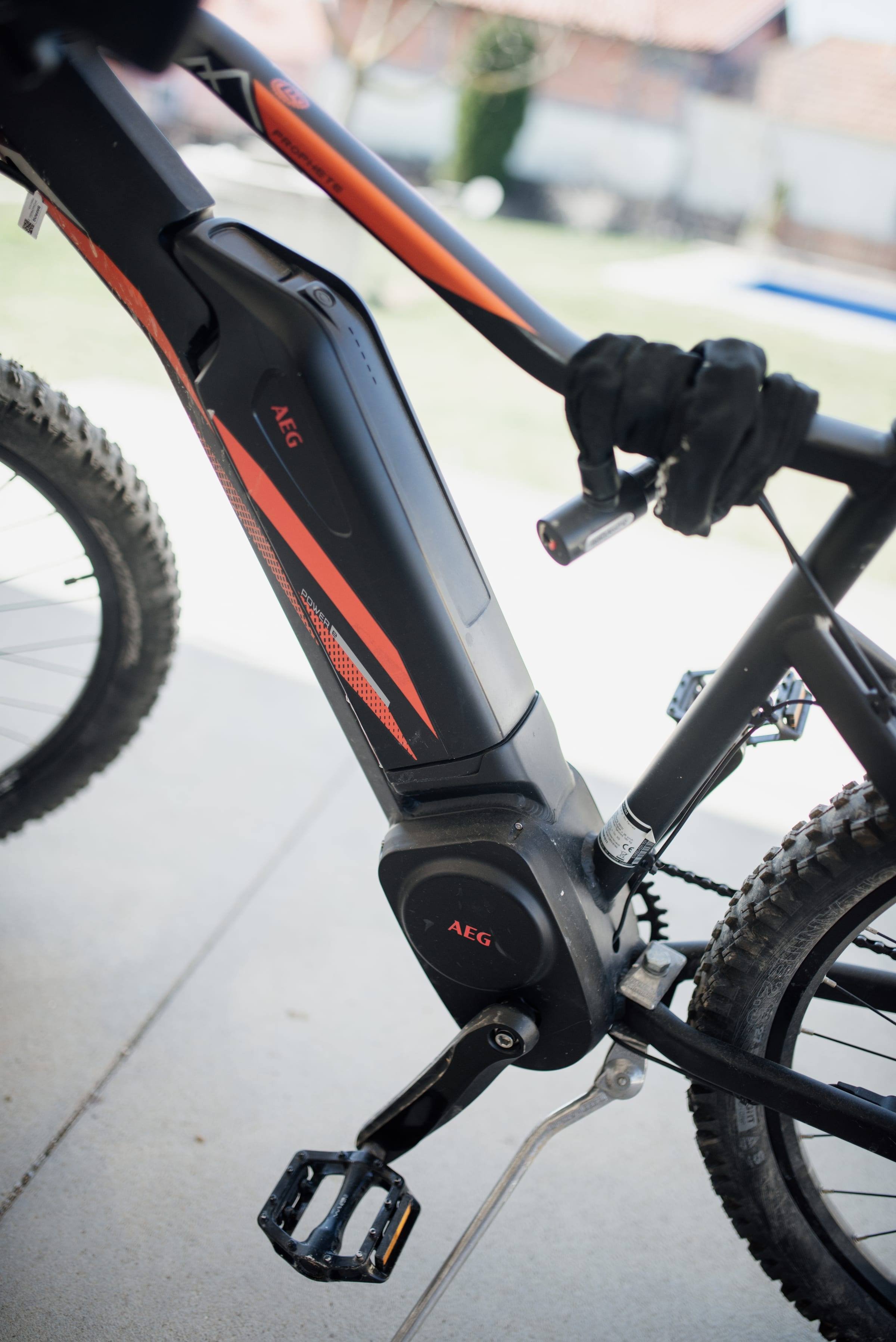 Close-up of a frame-mounted lithium-ion battery on an electric bike