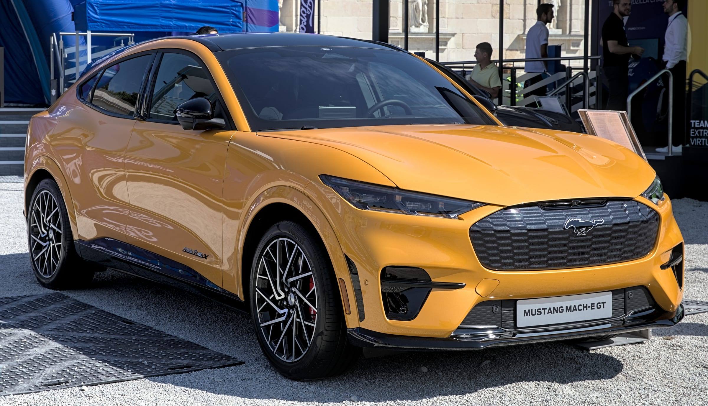 Yellow Ford Mustang Mach-E GT, front three-quarter view, at the IAA 2021 show in Munich