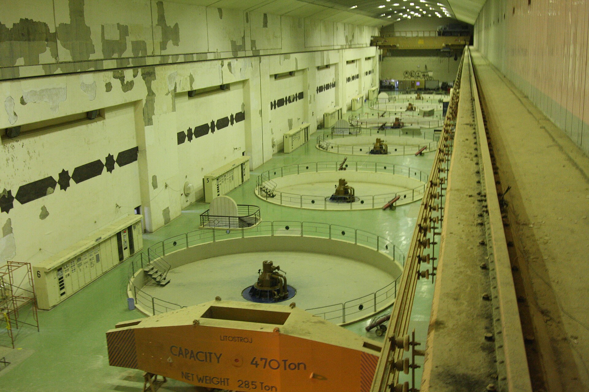 Large generators inside a hydroelectric dam turbine hall
