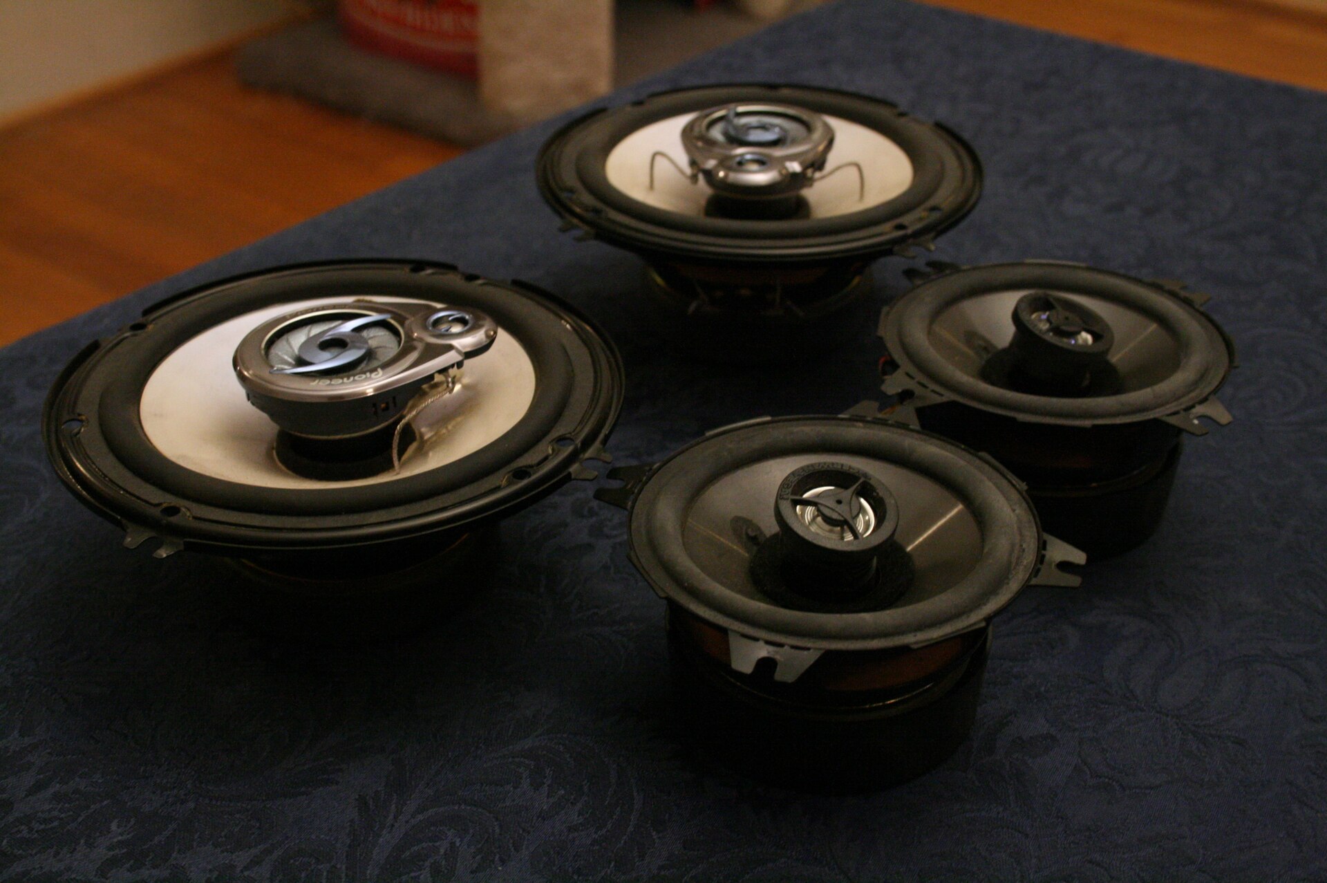 A set of loudspeaker drivers removed from a passenger car