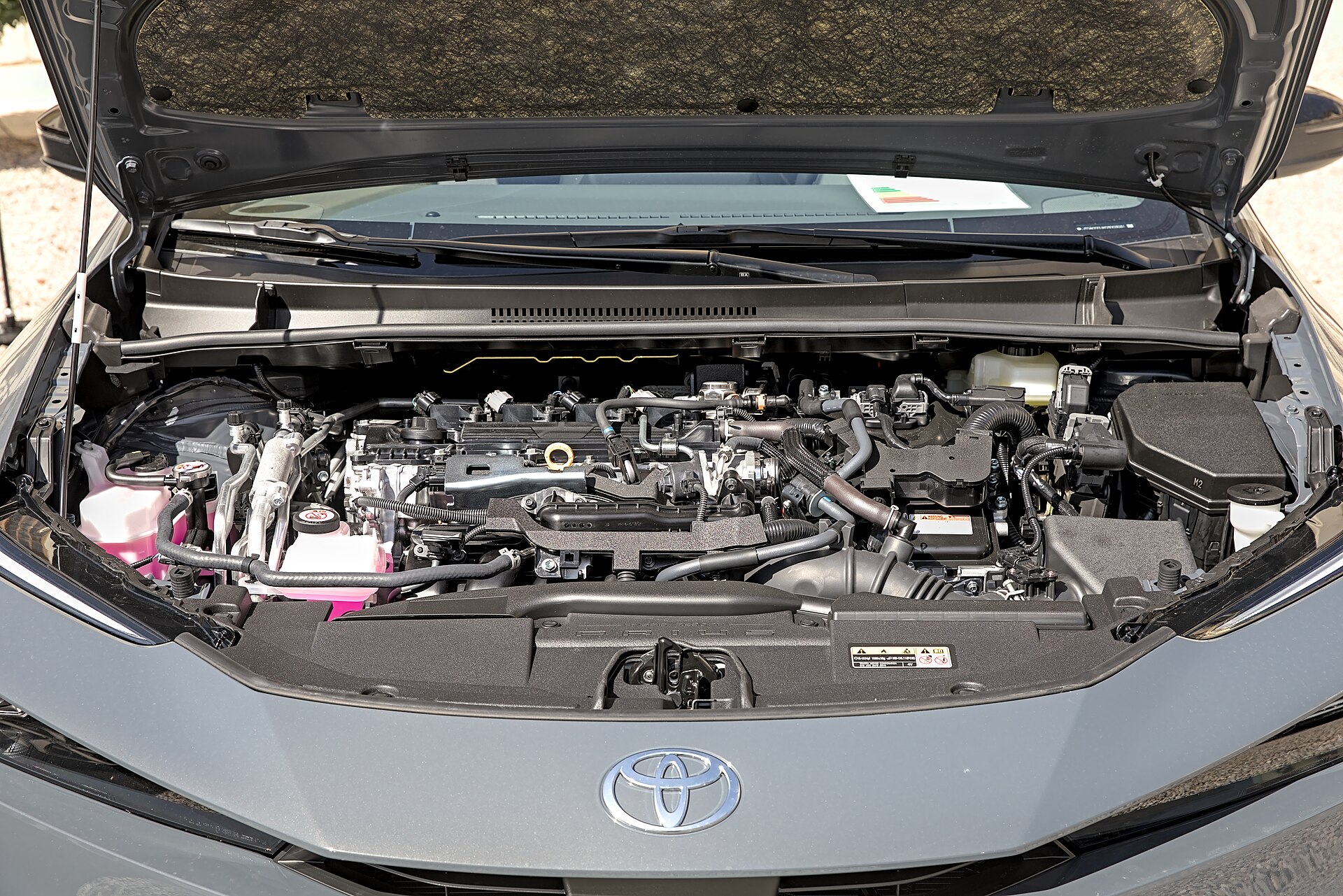 The open engine bay of a Toyota Prius plug-in hybrid